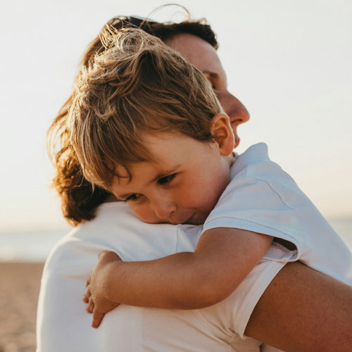 child in a mother's embrace